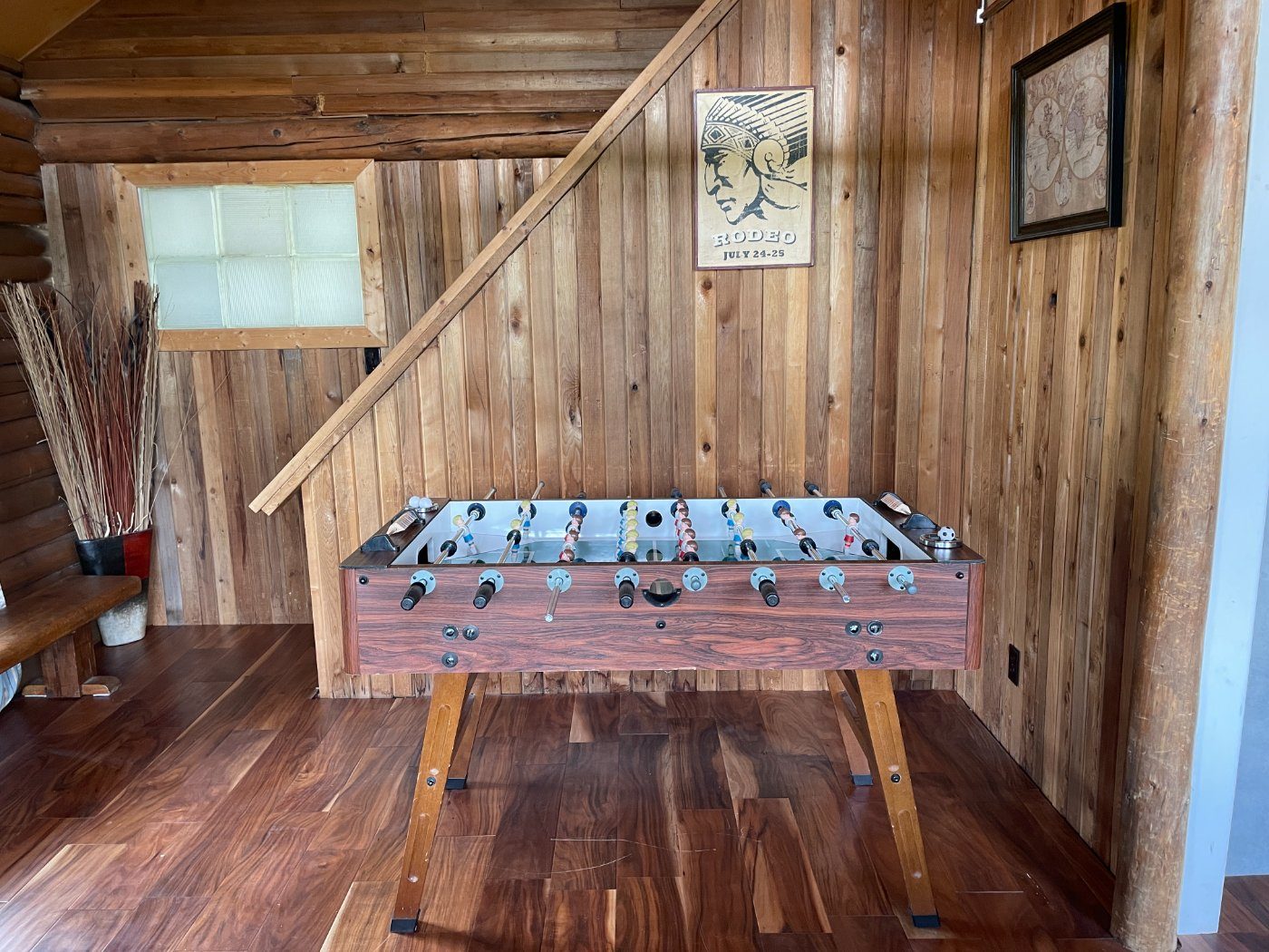 Foosball table tucked beneath the loft stairs